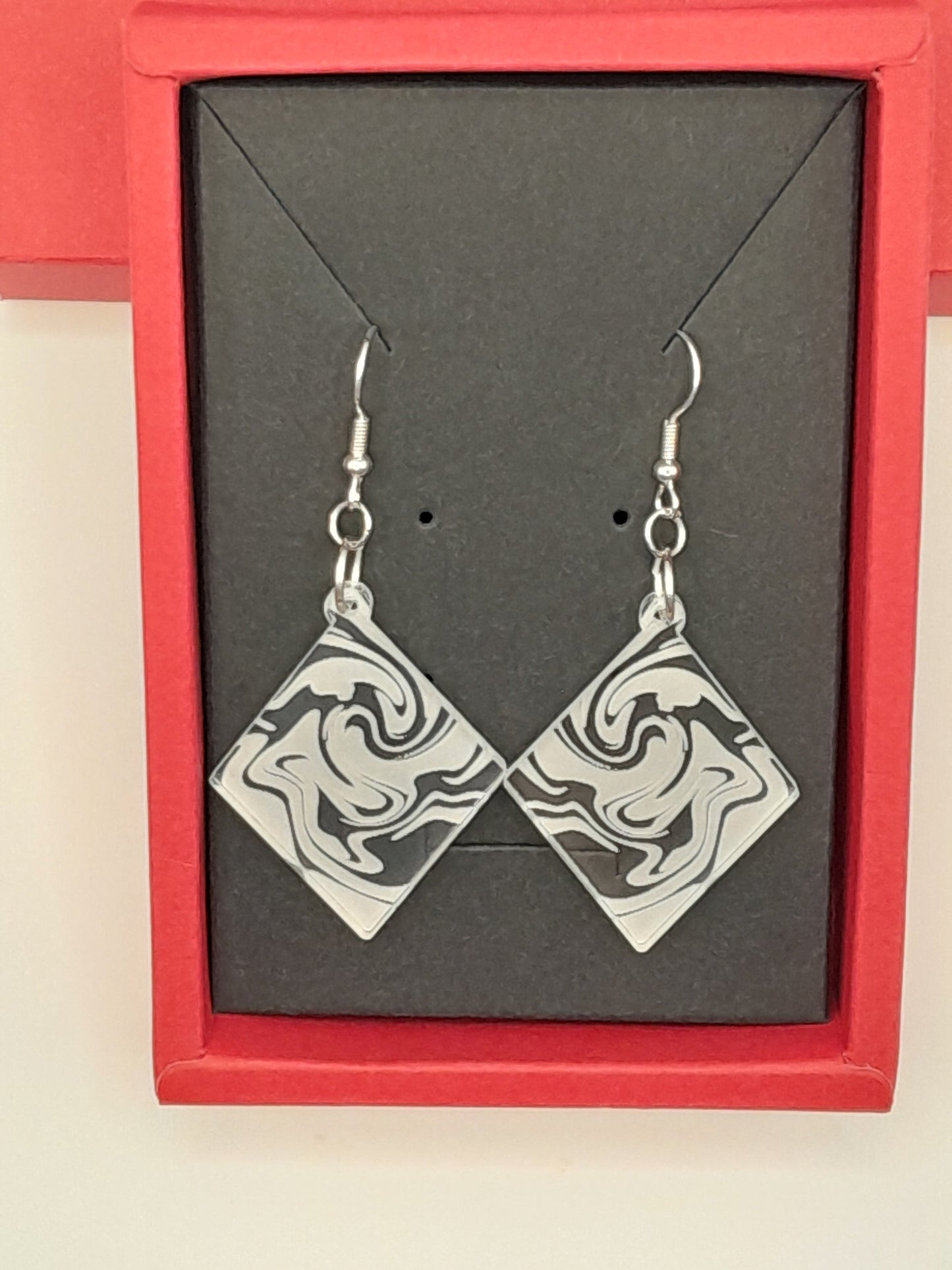 Acrylic diamond swirl earrings