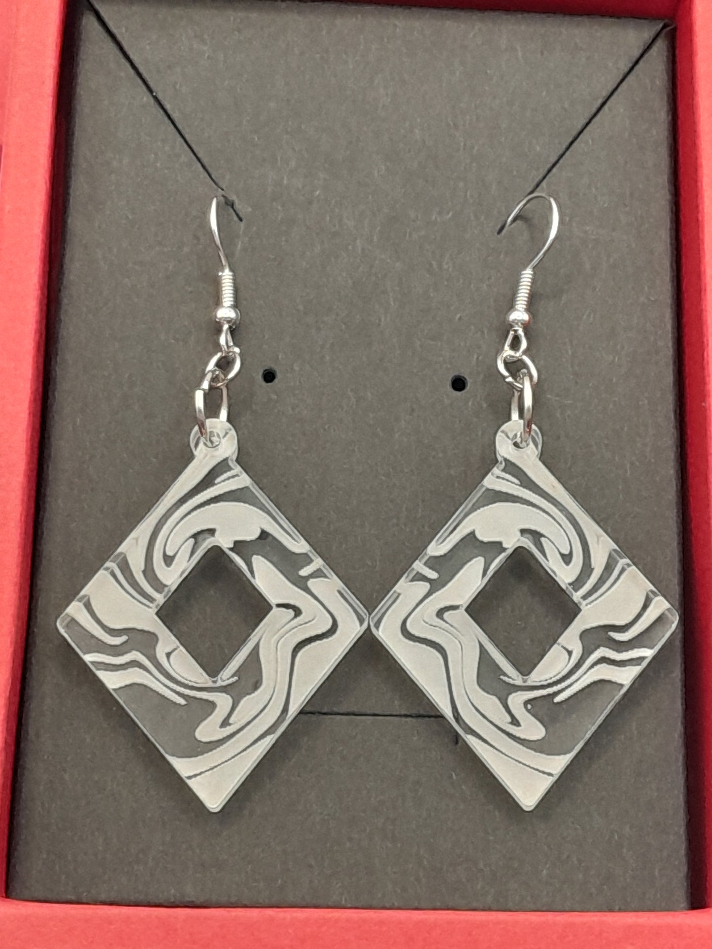 Acrylic diamond cutout swirl earrings