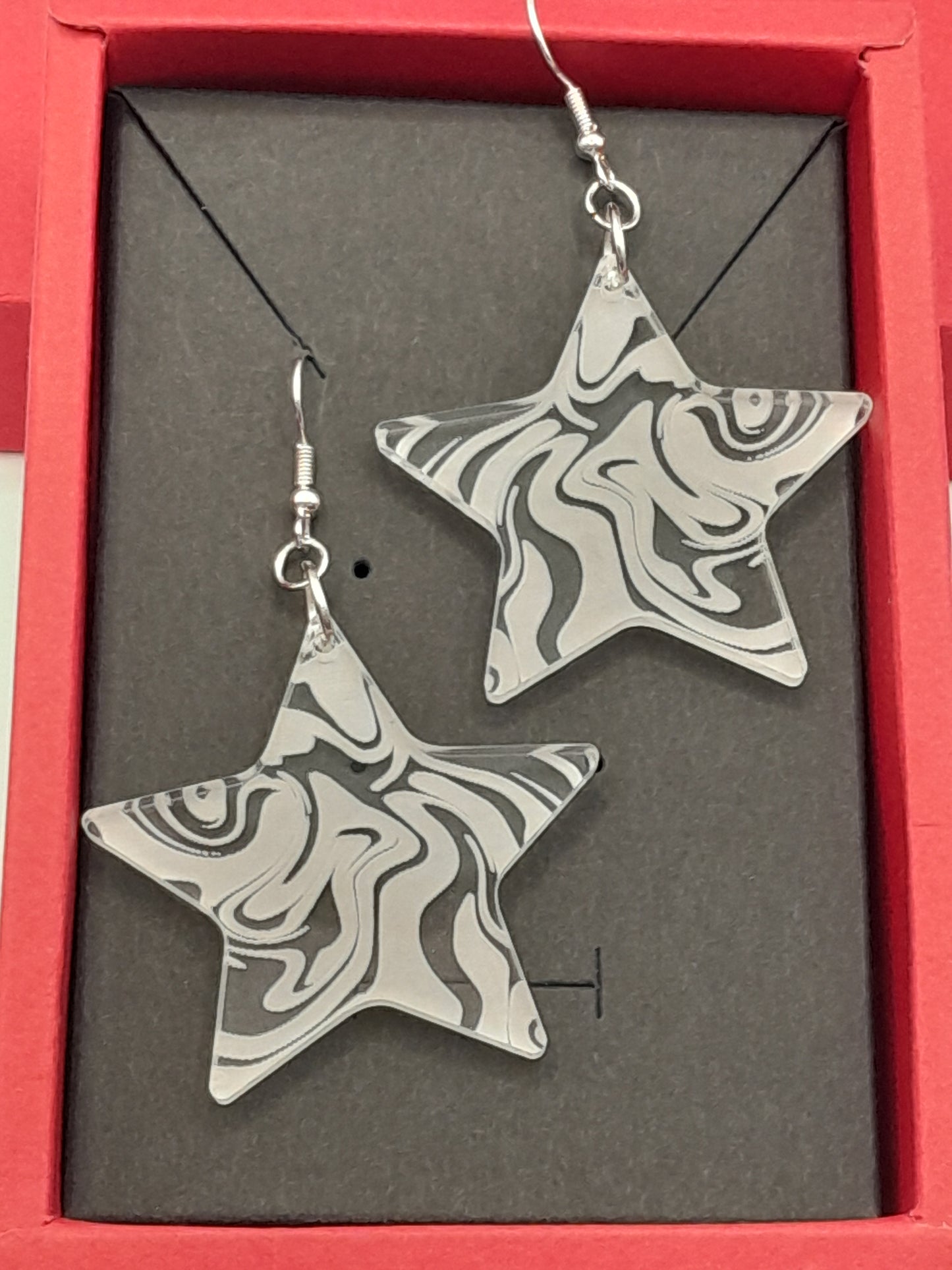 Acrylic star swirl earrings
