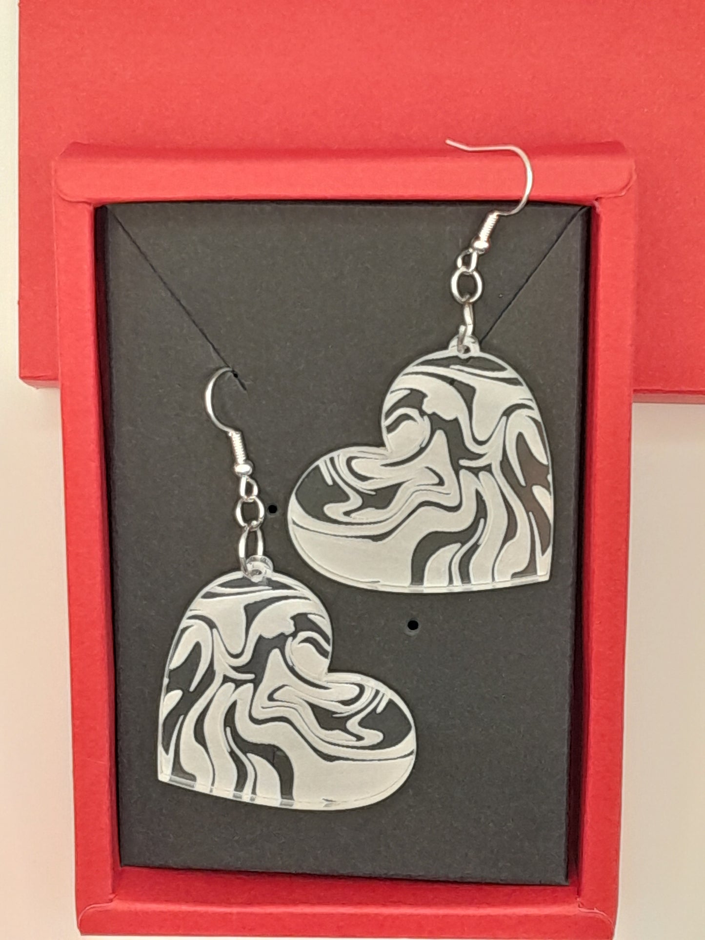 Acrylic heart swirl earrings