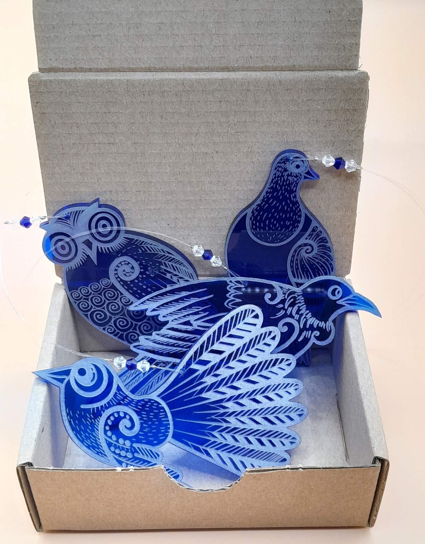 Set of four blue laser cut and engraved native NZ bird decorations