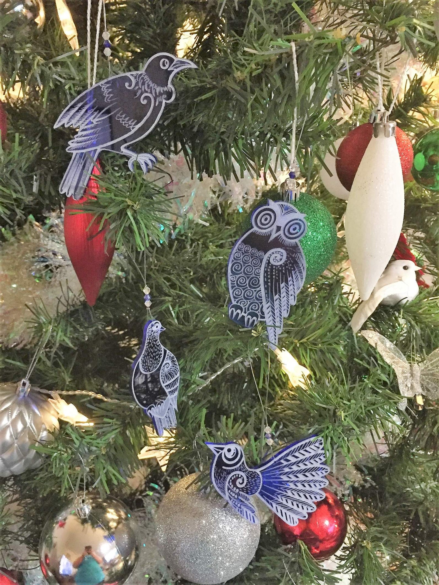 Set of four blue laser cut and engraved native NZ bird decorations