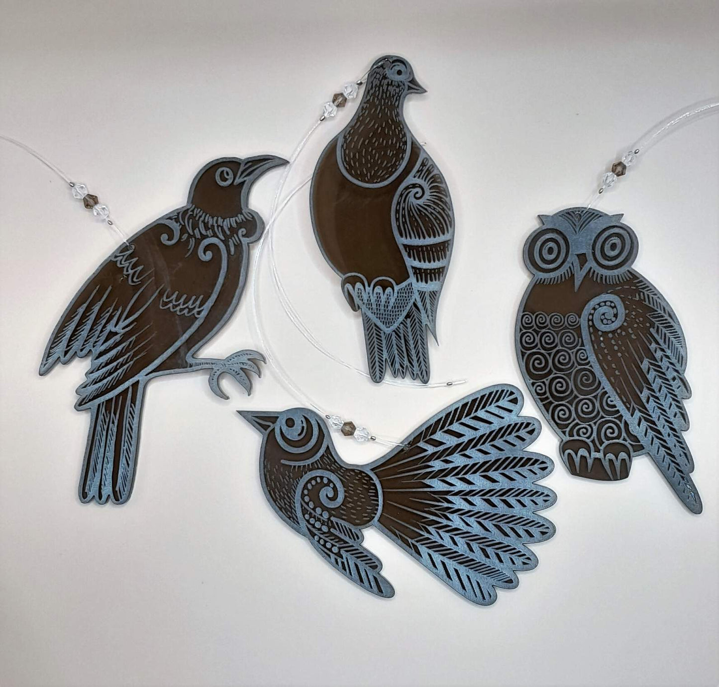 Set of four bronze laser cut and engraved native NZ bird decorations