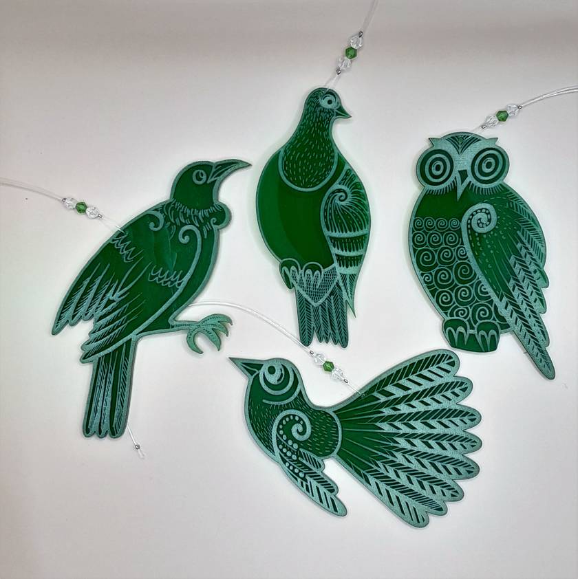 Set of four green laser cut and engraved native NZ bird decorations