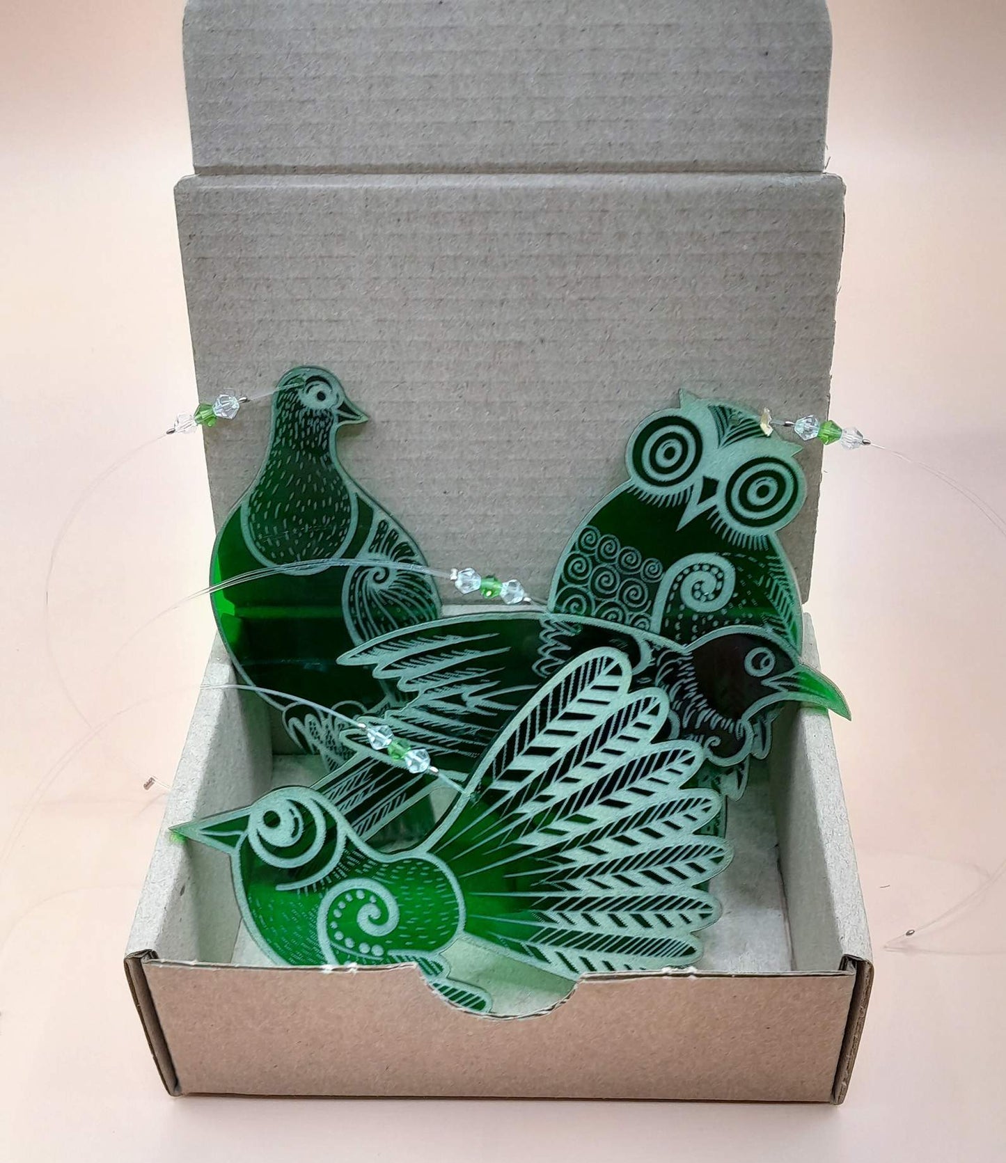 Set of four green laser cut and engraved native NZ bird decorations