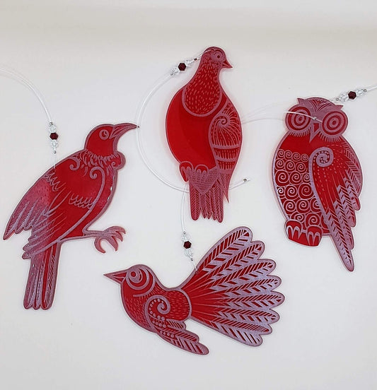 Set of four red laser cut and engraved native NZ bird decorations
